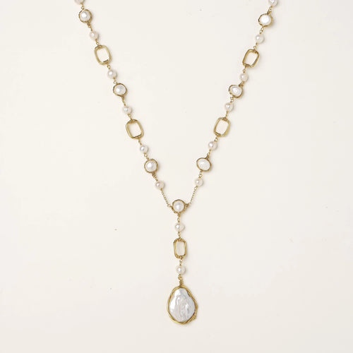 Y-shaped gold-plated necklace with freshwater pearls and geometric elements, featuring a baroque pearl pendant drop
