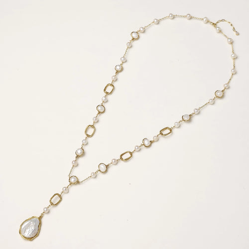 Y-shaped gold-plated necklace with freshwater pearls and geometric elements, featuring a baroque pearl pendant drop