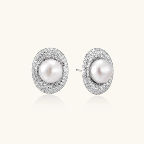 Sterling silver stud earrings with freshwater pearls surrounded by sparkling pavé crystals on white background.