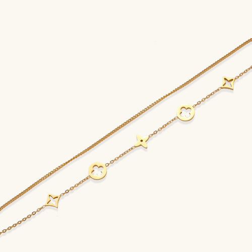 Dainty gold-plated bracelet with star and clover charms on double chain with adjustable extender