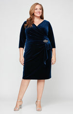 Plus Short Velvet Sheath Dress with Surplice Neckline, Cascade Skirt and Embellishment Detail at Hip