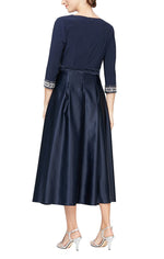 Petite Tea-Length Surplice Neckline Dress with High Low Full Skirt, Tie Belt and Beaded Detail on Sleeves - alexevenings.com