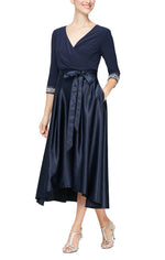 Petite Tea-Length Surplice Neckline Dress with High Low Full Skirt, Tie Belt and Beaded Detail on Sleeves - alexevenings.com