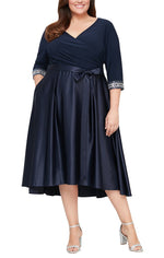 Plus Tea Length Surplice Neckline Dress with High Low Full Skirt, Tie Belt and Beaded Detail on Sleeves - alexevenings.com